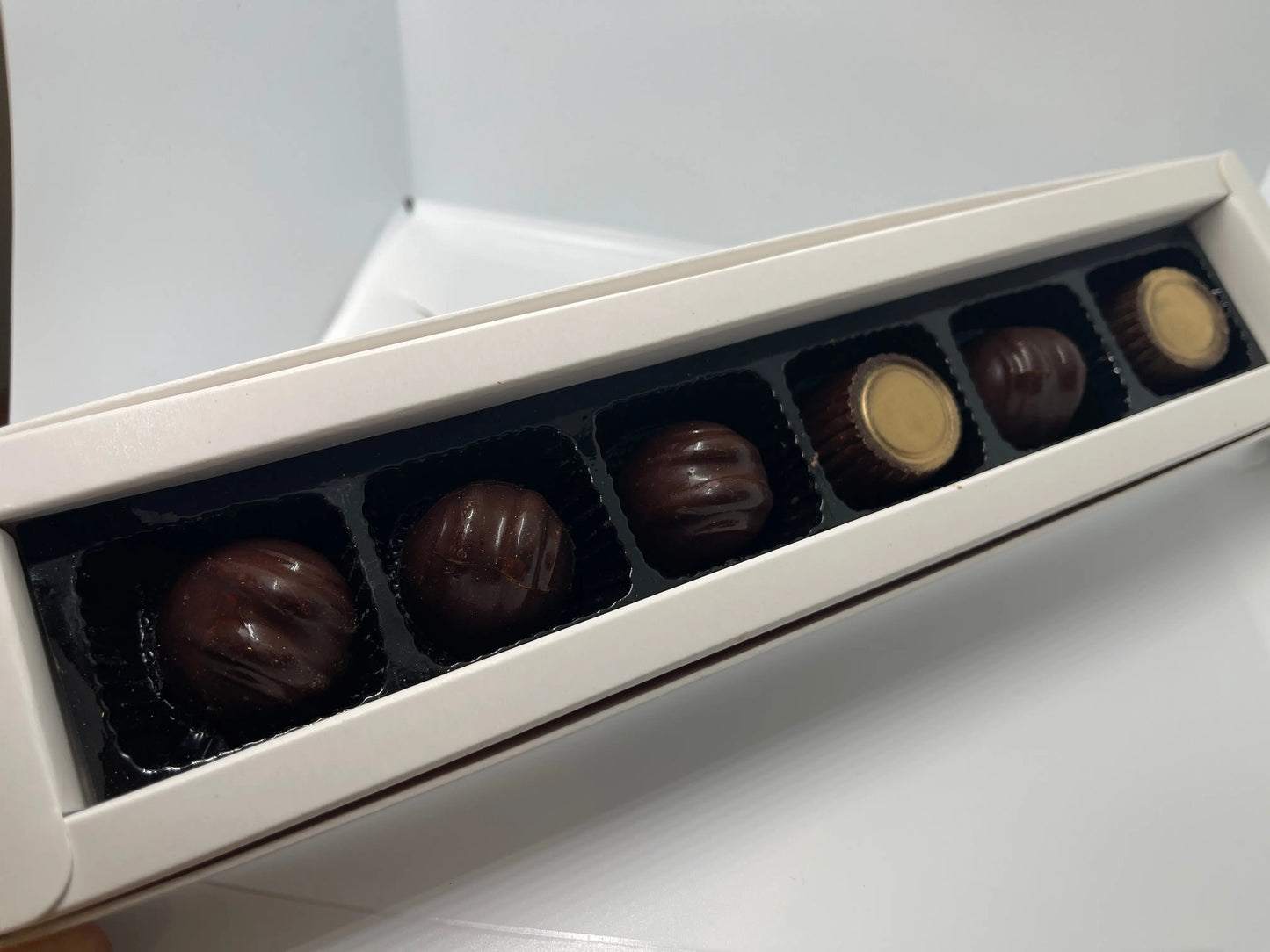 54% cacao Dark chocolate bonbon praline with orange liqueur ganache mix